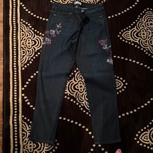 Denim jeans with embroidered flowers on each leg